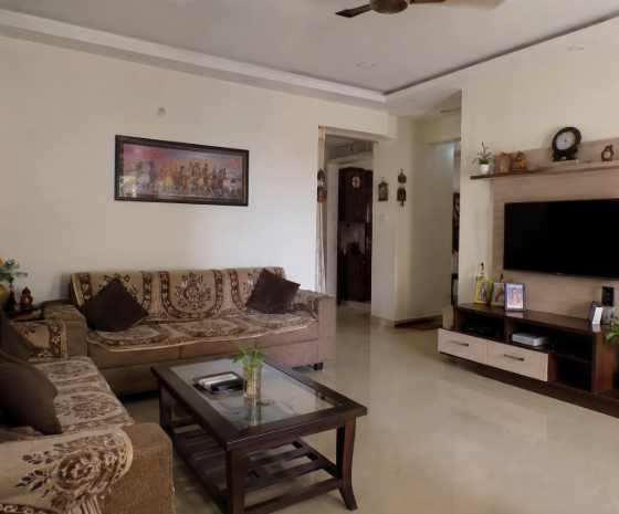 Elegant Indian Family Living Lounge with Warm Walnut Entertainment Unit, Traditional living room